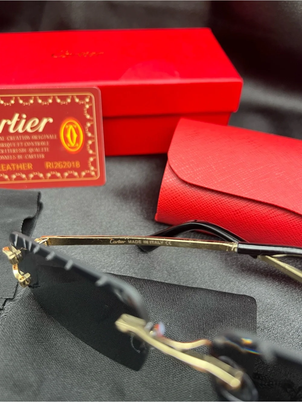Cartier Men's Black & Gold Rimless Sunglasses with Scalloped Lenses